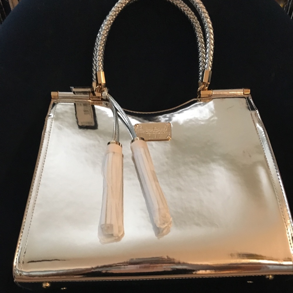 Silver mirrored Bebe handbag NWT